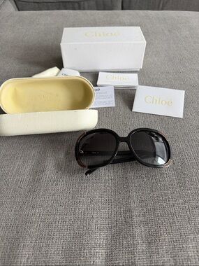 Chloe Round Women’s Black Sunglasses with Brown Leather Accents